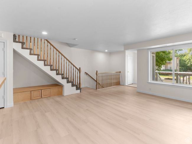 Unfurnished living room with wood finished floors and recessed lighting | Image 22