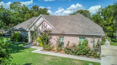 Landscaped with side entry garage and generous sidewalks | Image 2