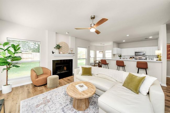 The spacious family room, conveniently located right next to the kitchen, features an open-concept floor plan that enhances the home’s flow. With plenty of room for your favorite furniture, it’s the perfect spot to relax or entertain. | Image 11