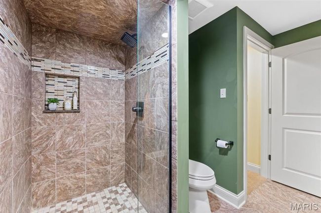 Full bathroom with tiled shower and toilet | Image 56