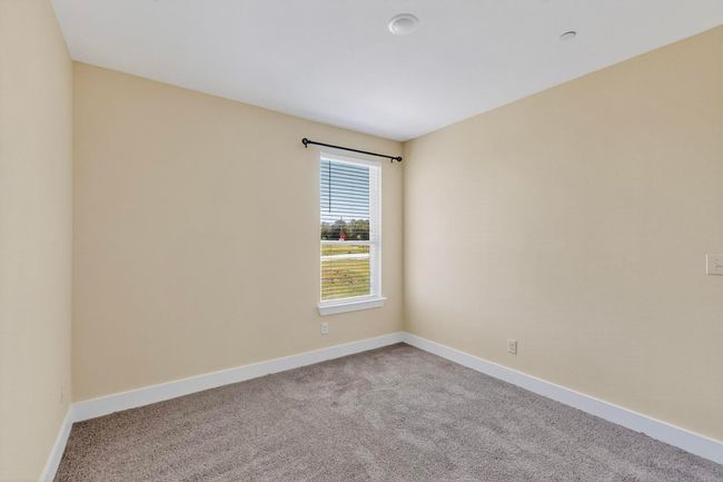 Carpeted empty room with baseboards | Image 23