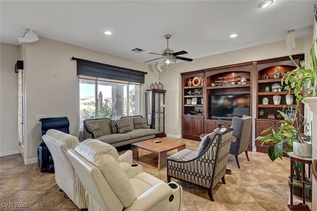 Living area featuring a ceiling fan, recessed lighting, and light tile patterned floors | Image 27