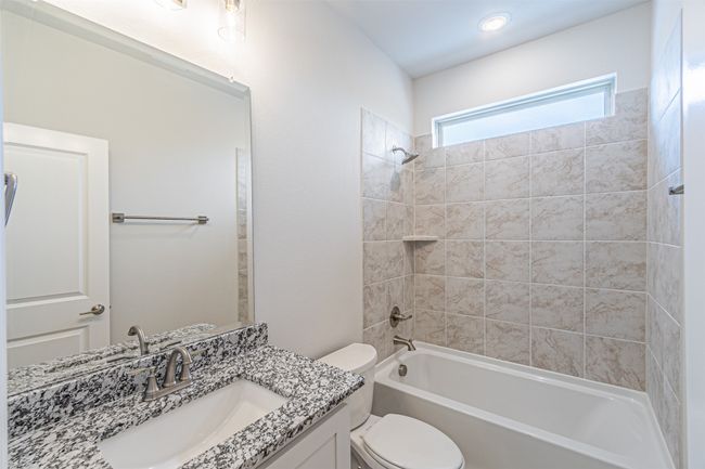 Full bath featuring vanity and bathing tub / shower combination | Image 8