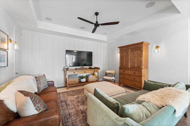 The custom wall treatment in the media room has to be seen in person to appreciate. A large media closet is also tucked away in the corner. | Image 25