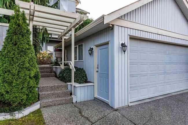 Exterior space with a pergola and a garage | Image 5