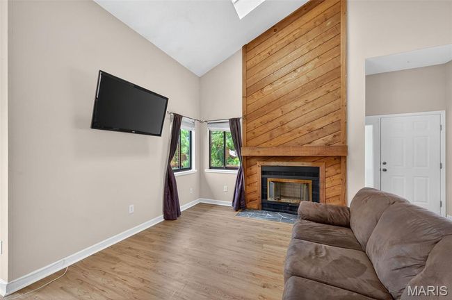 Great room with wood burning fireplace | Image 14