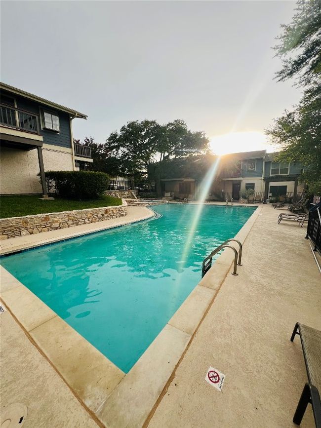 Community pool with a patio area | Image 4