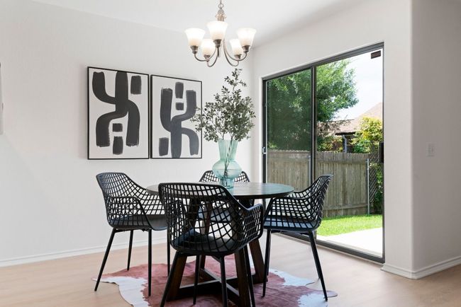 The dining space is tucked between the kitchen and the patio, making it super convenient for grabbing a bite or hosting get-togethers. | Image 10