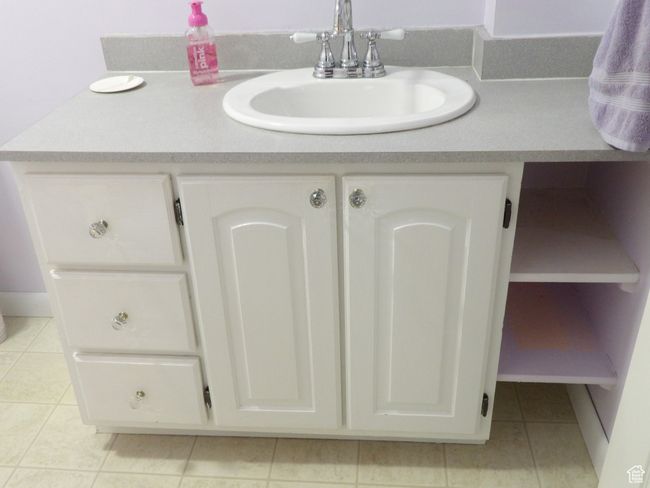 Bathroom vanity with storage area. | Image 28