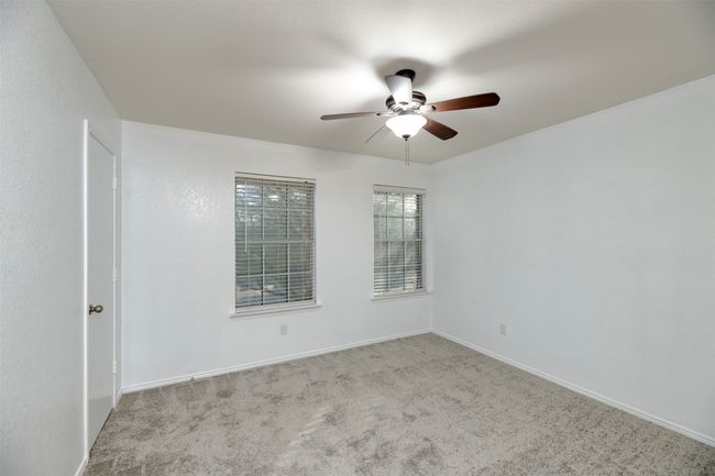 New Carpeted HUGE Master Bedroom featuring baseboards, visible vents, and a textured ceiling | Image 27