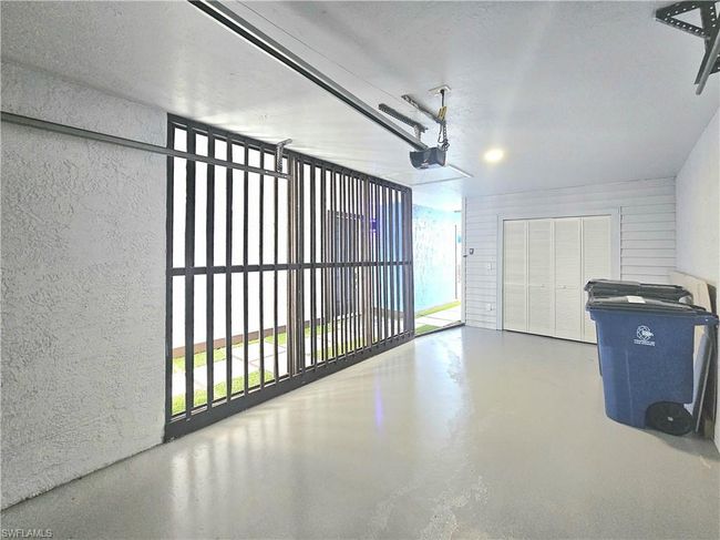 Garage featuring a garage door opener | Image 4