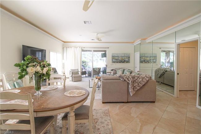 Tiled dining space featuring ceiling fan | Image 18