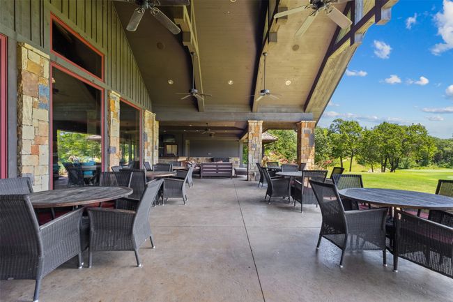 View of patio / terrace featuring outdoor dining space, ceiling fan, and an outdoor living space | Image 13