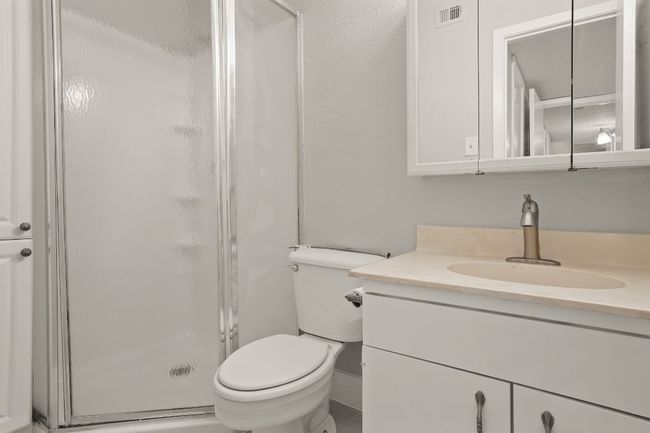 Full bathroom featuring vanity and a stall shower | Image 26
