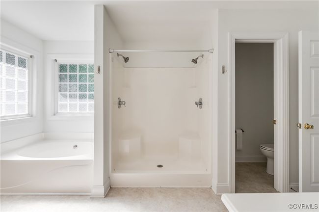 Full bath featuring a bath and a shower | Image 30