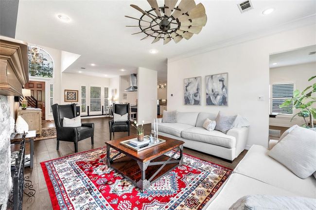 Grab a book and rest next to your large windows, overlooking the well landscaped backyard. | Image 12