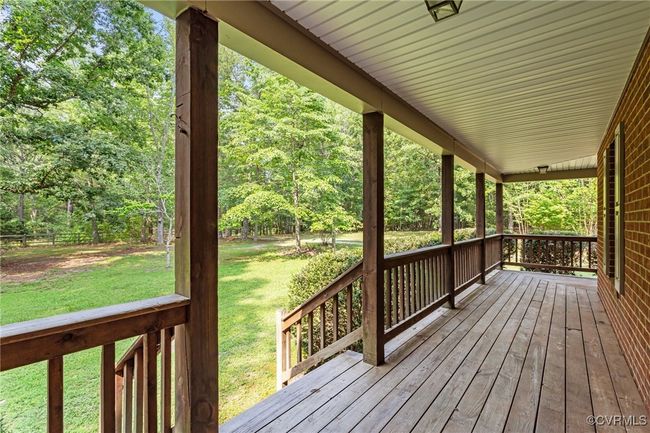 Wooden porch with a yard | Image 31