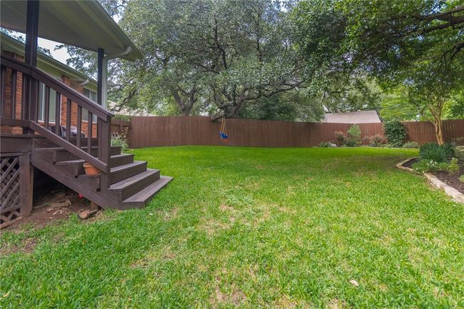 Fenced backyard with stairs | Image 28