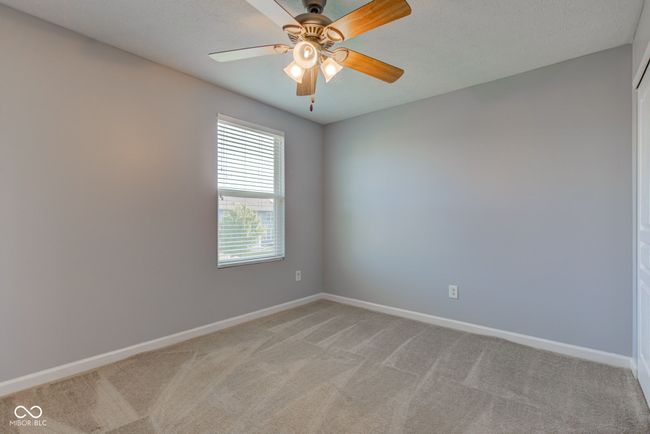 empty room with light colored carpet and ceiling fan | Image 39