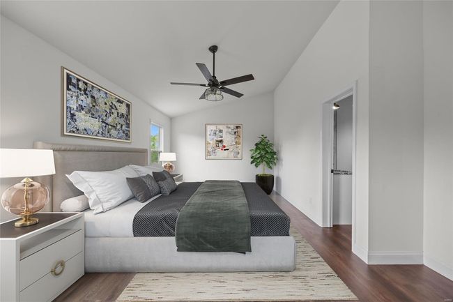 Bedroom with dark wood-type flooring, baseboards, ceiling fan, and vaulted ceiling | Image 34