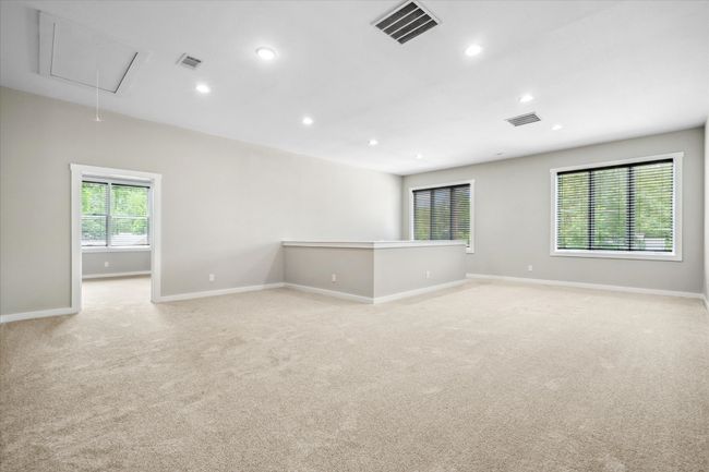Upstairs Living room featuring attic access, recessed lighting, baseboards, and light colored carpet | Image 24