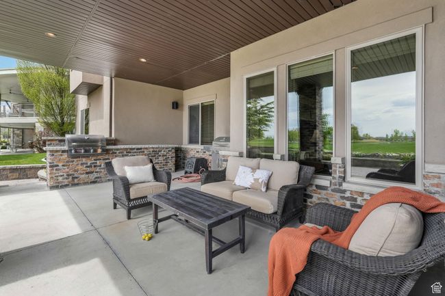 View of patio / terrace featuring area for built-in grilling, an outdoor hangout area. | Image 16