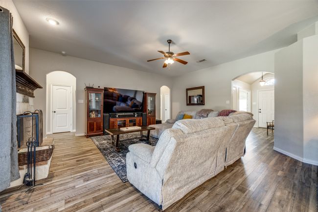 Living room with hardwood / wood-style floors and ceiling fan | Image 8
