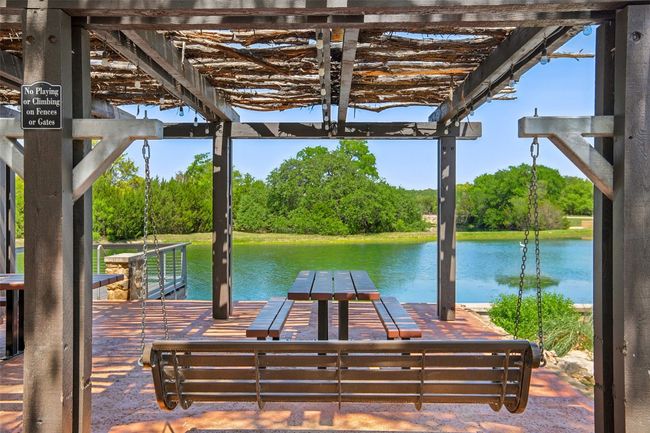 Dock area with a water view and a pergola | Image 34