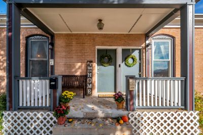 View of exterior entry with a porch | Image 1