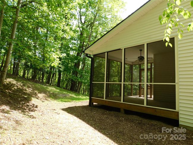 Screened-in porch offers pest-free peace. | Image 4