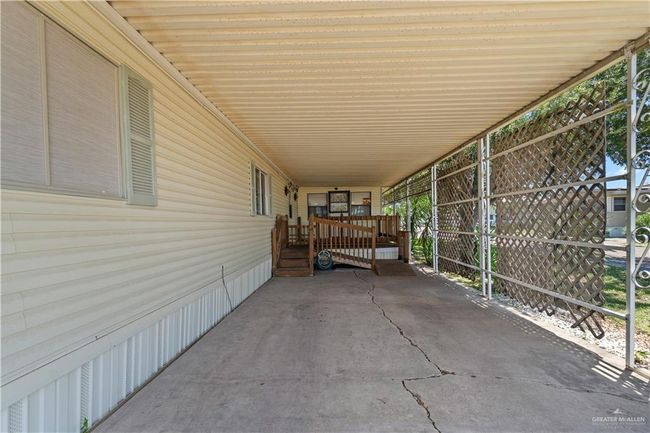 View of patio / terrace featuring a carport | Image 17