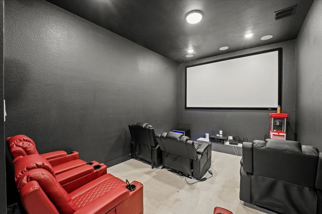 Carpeted cinema featuring recessed lighting and a textured wall | Image 12