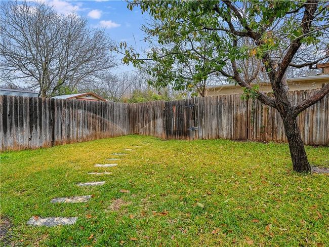 View of fenced backyard | Image 30