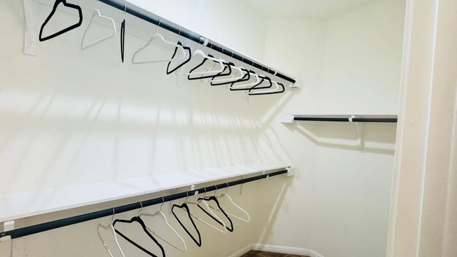 View of walk in closet | Image 25