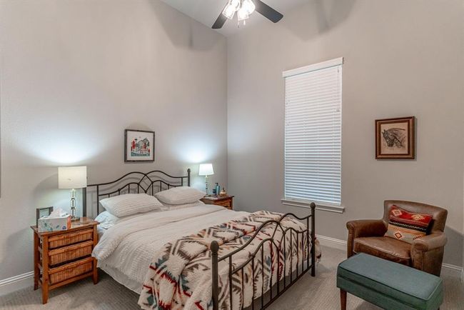 Bedroom with ceiling fan and carpet floors | Image 25