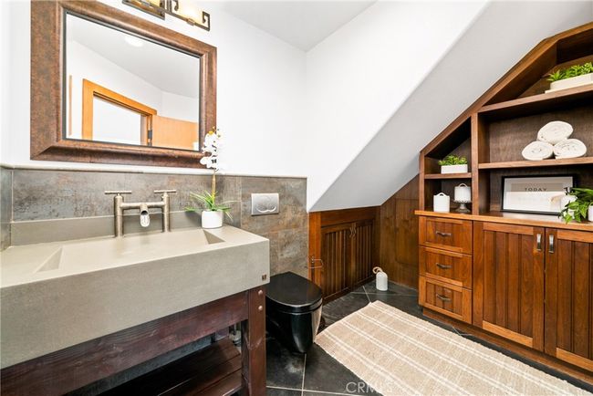 Nicely appointed custom ½ bathroom on level 1. | Image 23