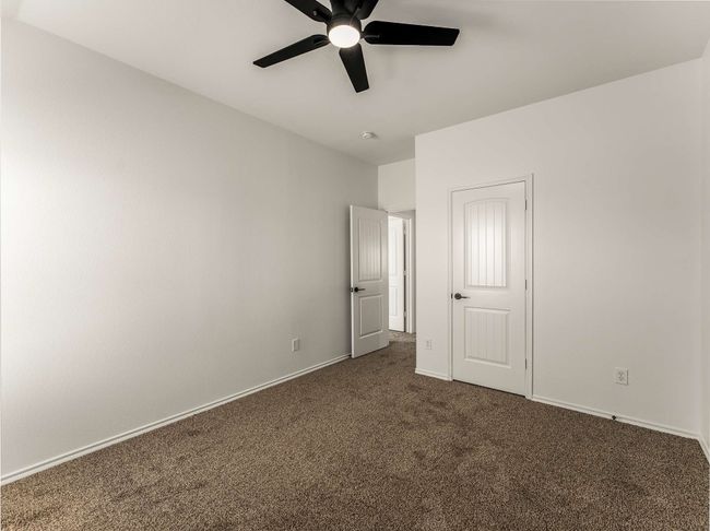 Unfurnished bedroom featuring dark colored carpet and ceiling fan | Image 31