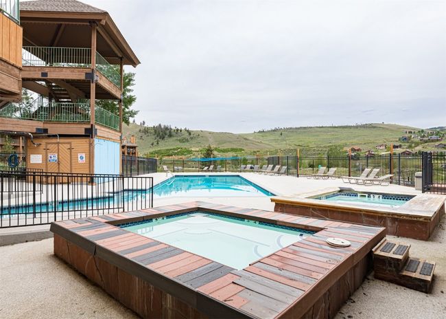 Community pool with a community hot tub and a patio | Image 23