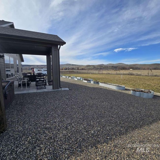View of yard with a patio and a mountain view | Image 23