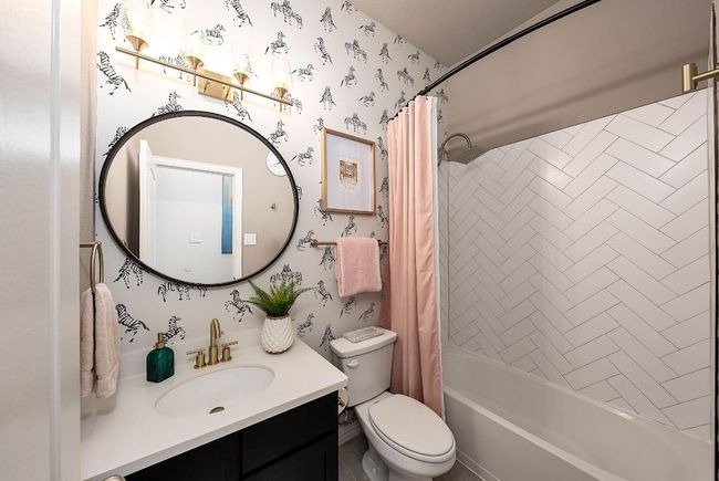 Bathroom has upgraded paint and added wallpaper. | Image 16