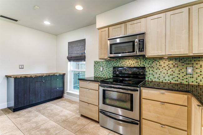 Extra work space in kitchen. Could be breakfast nook or open up to dining. | Image 10