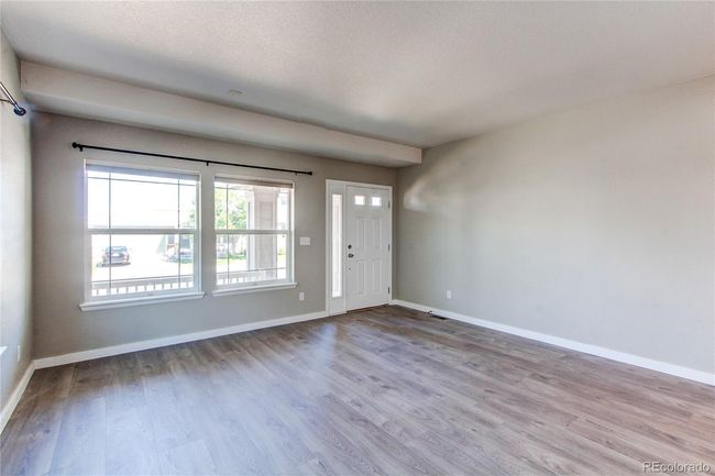 Living room looking at front door | Image 8