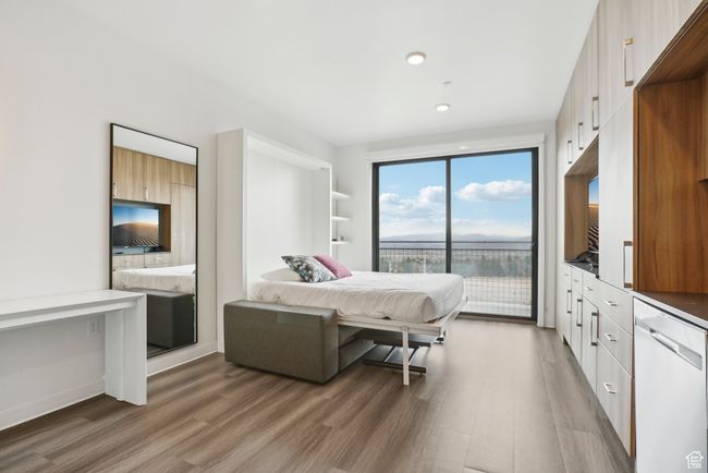 Bedroom with light wood-type flooring, recessed lighting, and access to exterior | Image 16