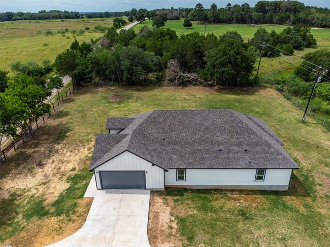 Aerial view of property and surrounding area with a tree filled landscape | Image 28