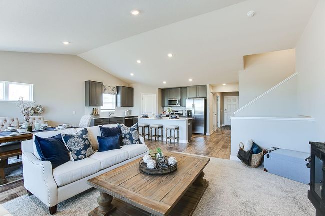 The Finnegan's main level living space. Photos of model home. Colors and options may vary. Ask Sales Agent for details. | Image 11