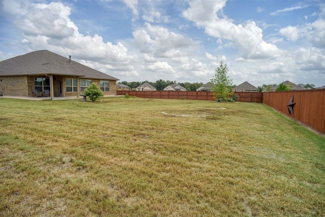 Fenced backyard featuring a patio | Image 31