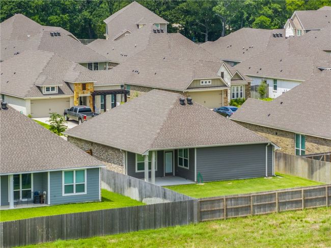 Rear view of house with a residential view and roof with shingles | Image 34