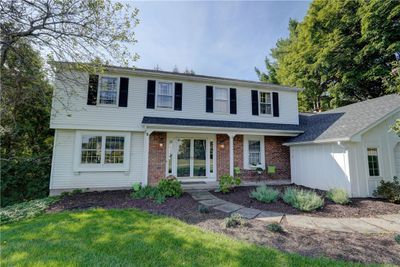 Landscaping options abound...this image shows a slate stone walkway from the driveway to the covered front porch. | Image 3