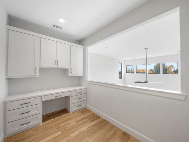 3rd floor Unfurnished office featuring built in study area, light wood-style flooring, a ceiling fan, and recessed lighting | Image 28