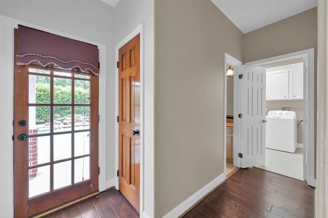 Back door. on the left, Laundry on the right, 1/2 bath in the middle. Notice the pool through the door's window. | Image 18